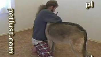 Guy works dog's vagina in insane home zoo video