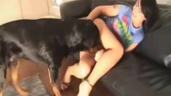 Doberman fucks a skinny dark-haired chick and blows a massive cumshot