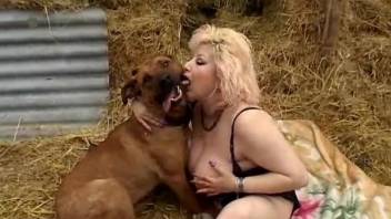Busty chick with pierced pussy is trying dog bestiality in the barn