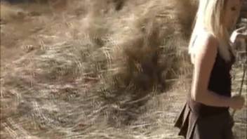 Fair-haired woman frolics with her beast-loving canine and gets skewered