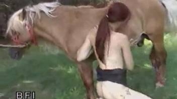 Sexy redhead babe with innocent face is trying oral bestiality