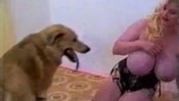 Blonde with grotesquely large breasts gets fucked by a dog