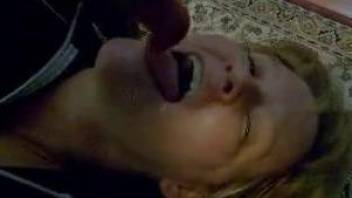 Blond-haired MILF blows a very hot dog boner on the floor