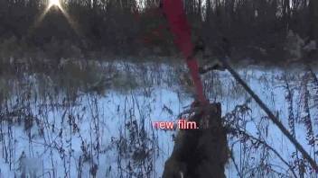 Intoxicated Russian whore licking a canine's rear end outside