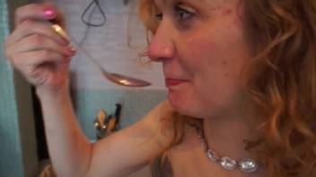 Naughty ginger-haired chick gulps down something bizarre