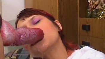 Red-haired hottie deepthroating a thick red dick