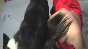 Dark-haired lady in crimson gown playing with a monster