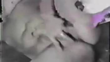 Classic 1990s animal sex video featuring a well-trained dog and a married woman