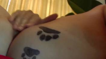 Naked brown-haired woman penetrated by a dog in live webcam bestiality