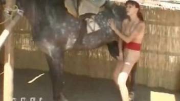 Redhead gives head on giant horse cock before enduring sex