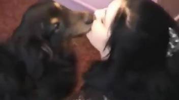 Brunette puts her lips to a great use with a dog