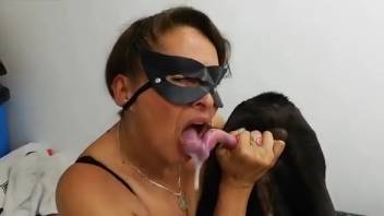 Masked Hispanic woman deep-throating a canine's massive dick