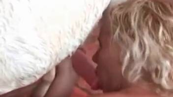 Curly-haired blonde bangs a freaky pony in the open air