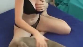 Big-breasted beauty showing her lust for dog dicks