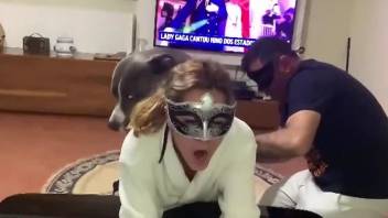 Masked lady with a firm booty gets fucked by a dog