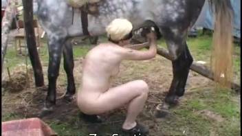 Bobbed-haired young girl 18+ pleasures herself using a stallion's thick cock